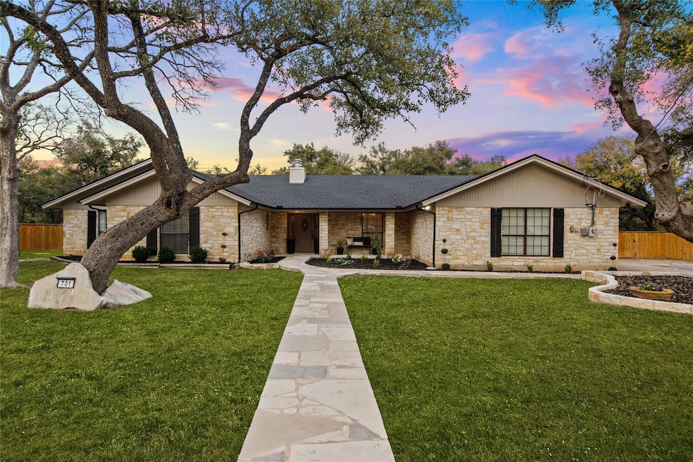 Mid-century home featuring stone siding, a chimne