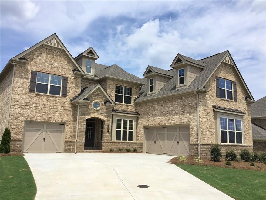 Stunning, 3.5 sides brick and stone 3 car garage h