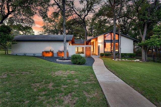 This home is perched prominently on one of the lar
