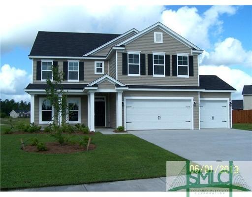 Exterior Front. Home located on a wide lot, has a 