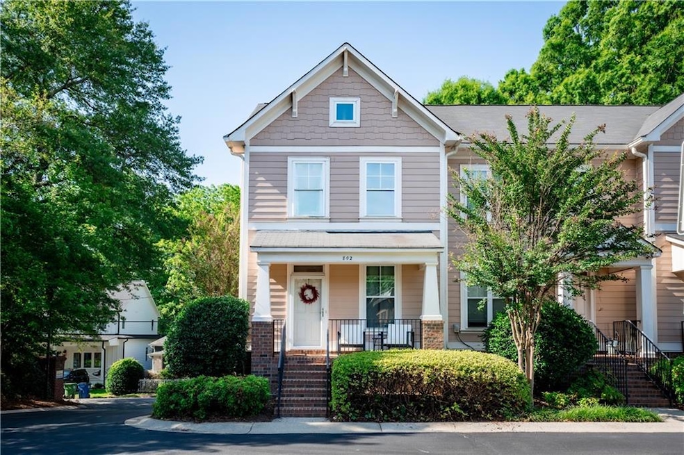 Craftsman inspired home with a porch and brick siding