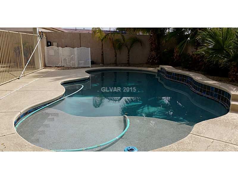 Property Photo. Sparkling Pool with Wet Deck.