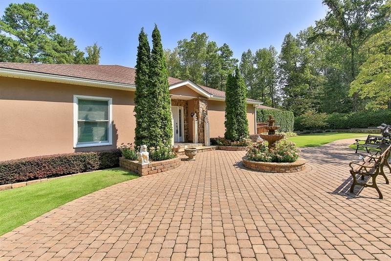 Gorgeous terrace at front entry with expanse of pa
