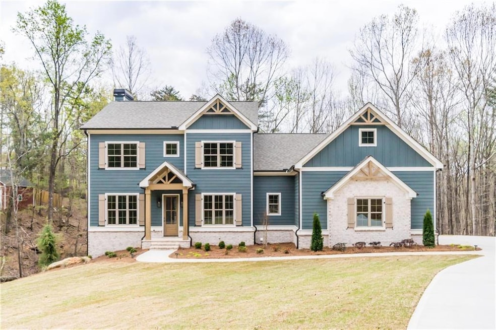 View of front of house featuring roof with shingle