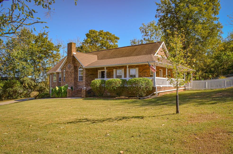 2010 Wild Cherry Ct, Lewisburg, TN 37091: All brick home with wraparound porch on 1/2 acre lot. Located near I-65, 30 minutes to Cool Springs Galleria and an hour to downtown Nashville.