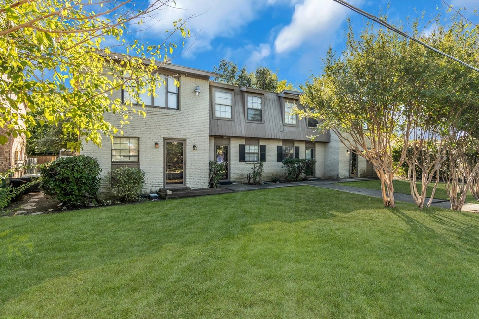 View of front of property with a front yard and a 