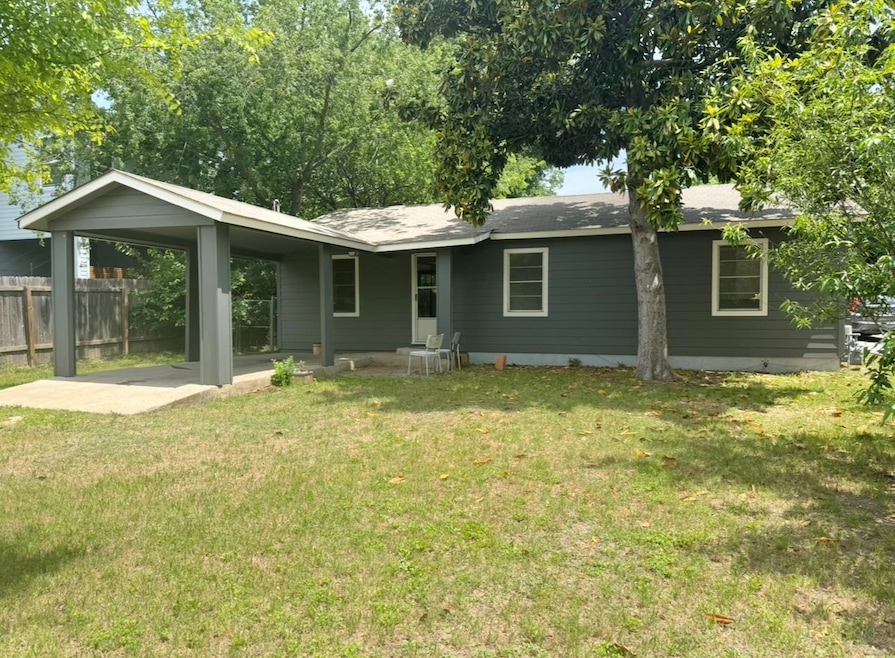 Ranch-style house with an attached carport