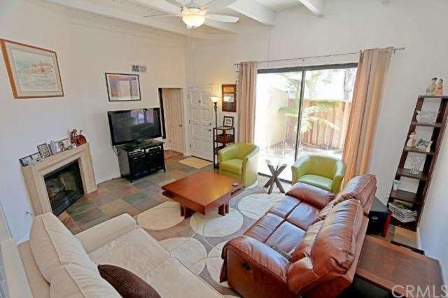 Living room looking to entry and patio