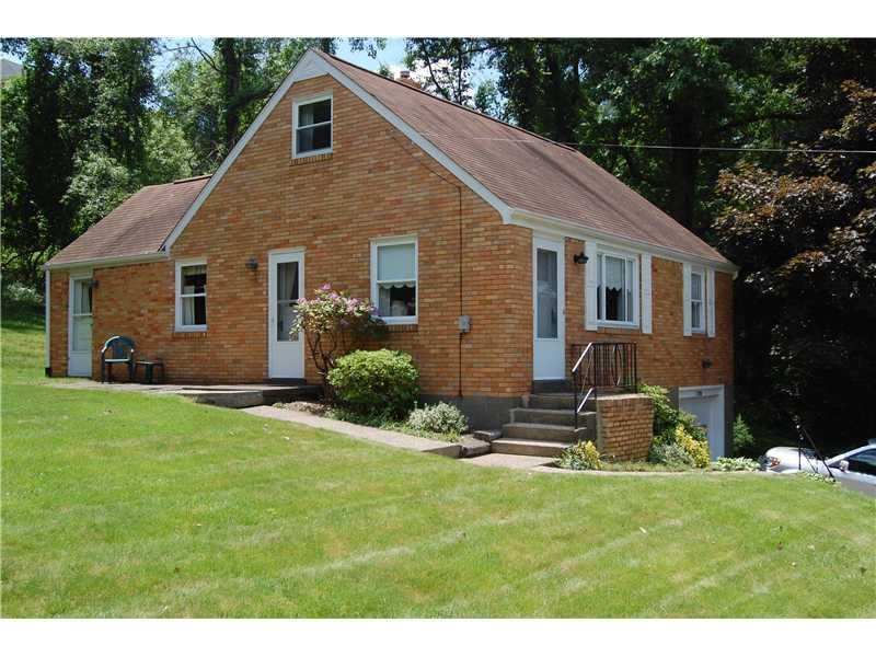 Exterior Front. Well maintained solid brick home.
