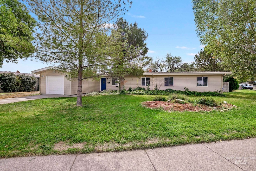 Single story home with concrete driveway, a front lawn, and a chimney