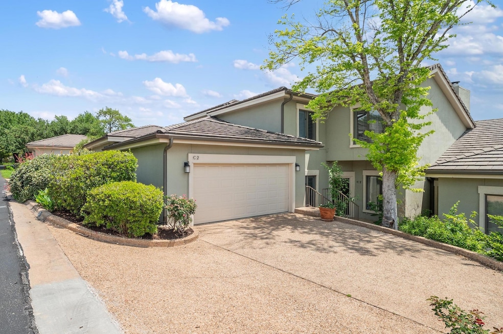 View of front of house with a garage, a tiled roo