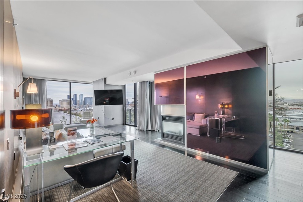 Living area featuring floor to ceiling windows, wo