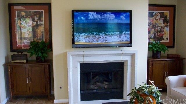 Beautiful art work accompanied fireplace in the gr