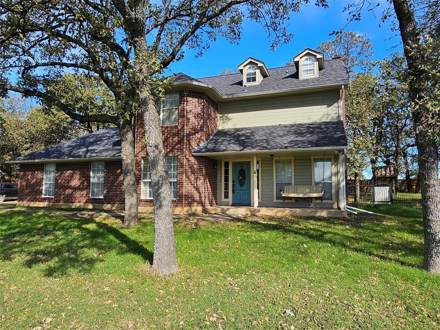 View of front of property featuring covered porch 