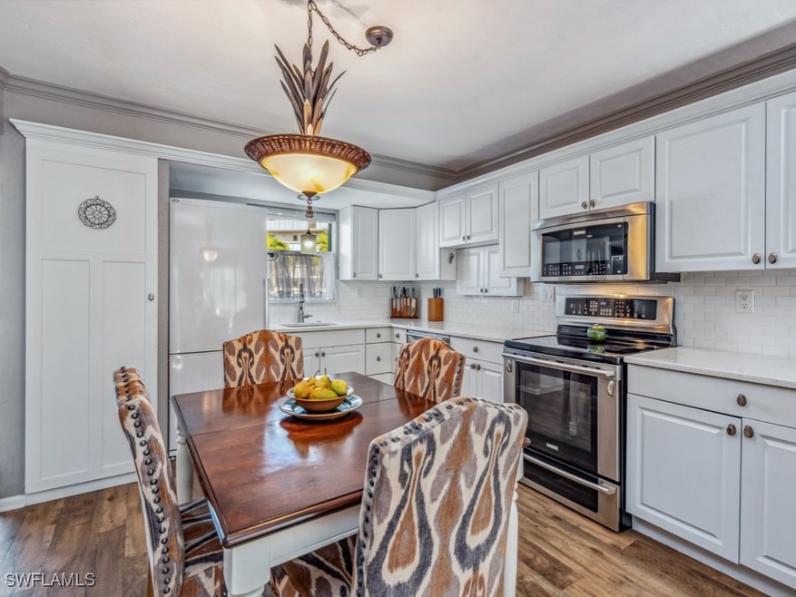 Kitchen with appliances with stainless steel finis