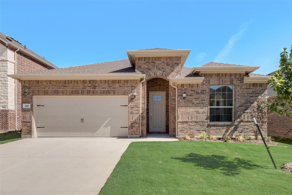 View of front of house featuring a garage and a fr