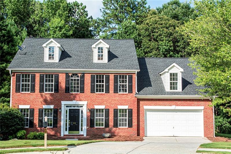 Sweet American Colonial. Double car garage with ne