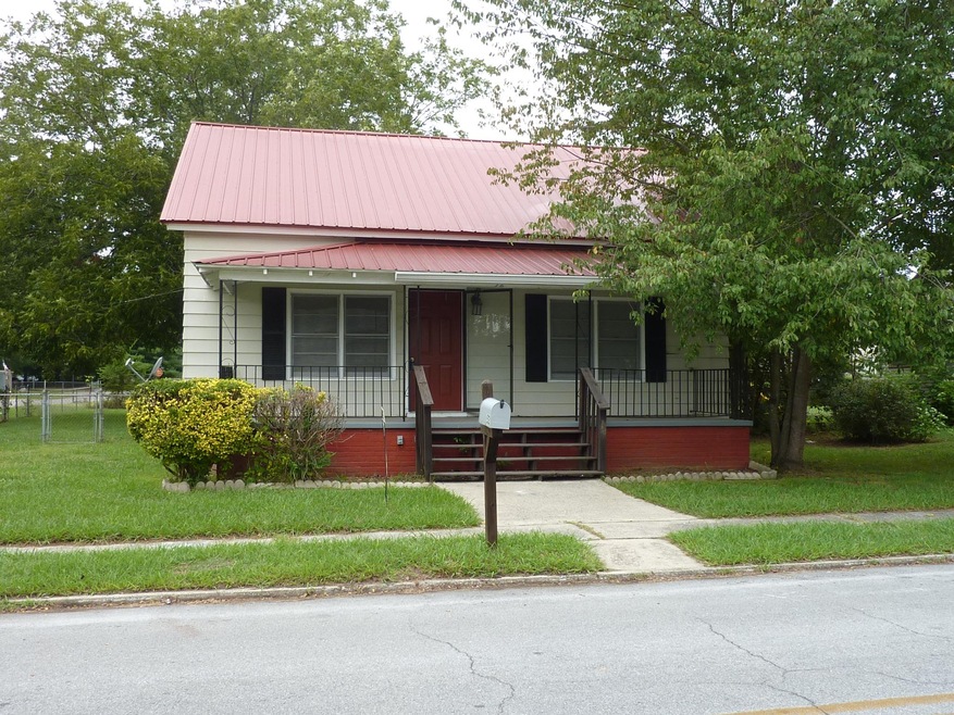 More space than appears. 3 BR/2 BA on large corner