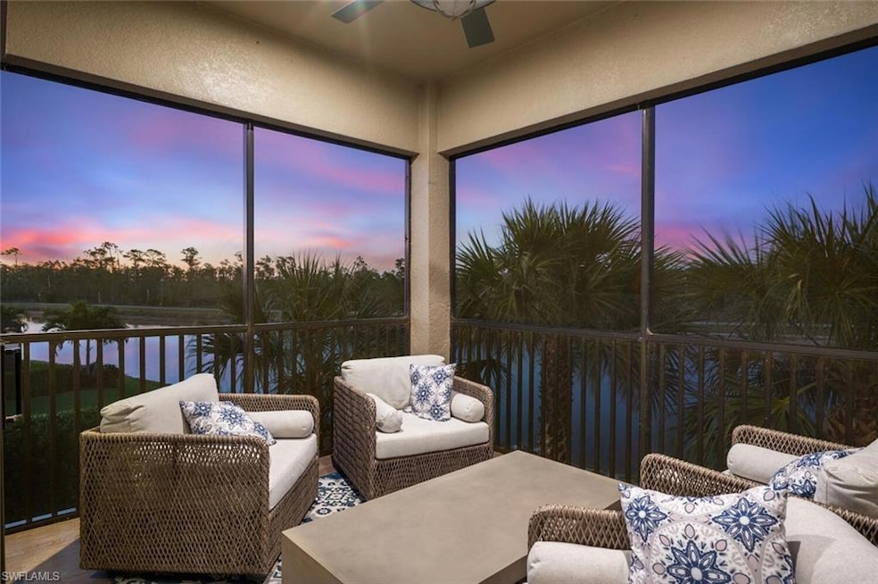 Sunroom featuring a water view and a ceiling fan