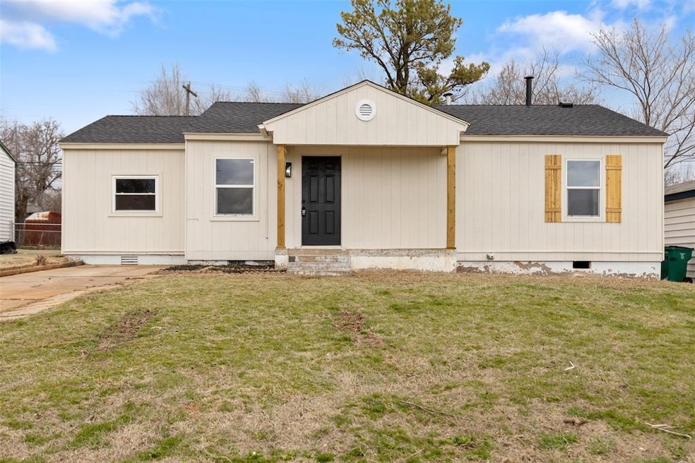 View of front of house with a front yard, crawl sp