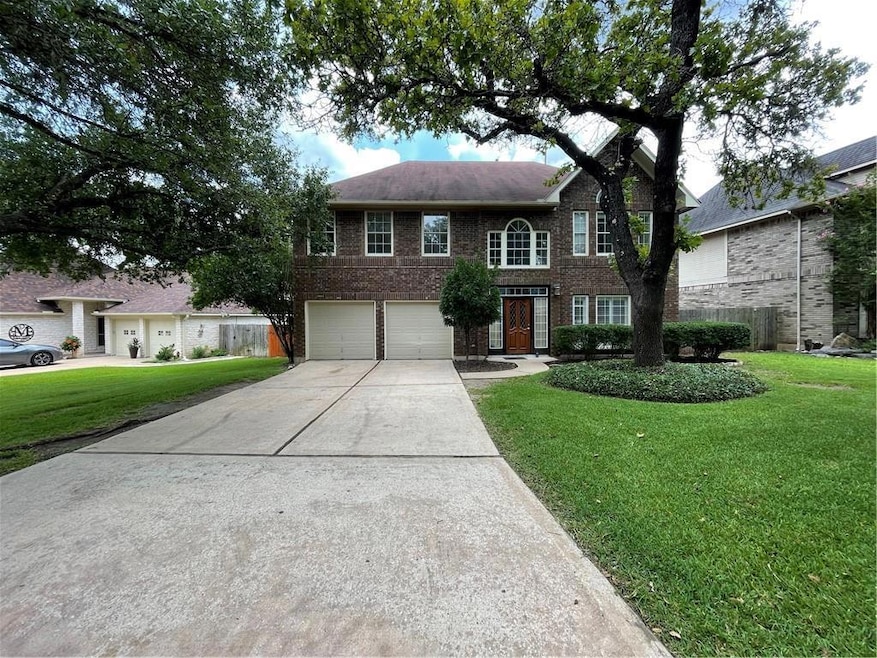 View of front facade featuring a garage, a front 