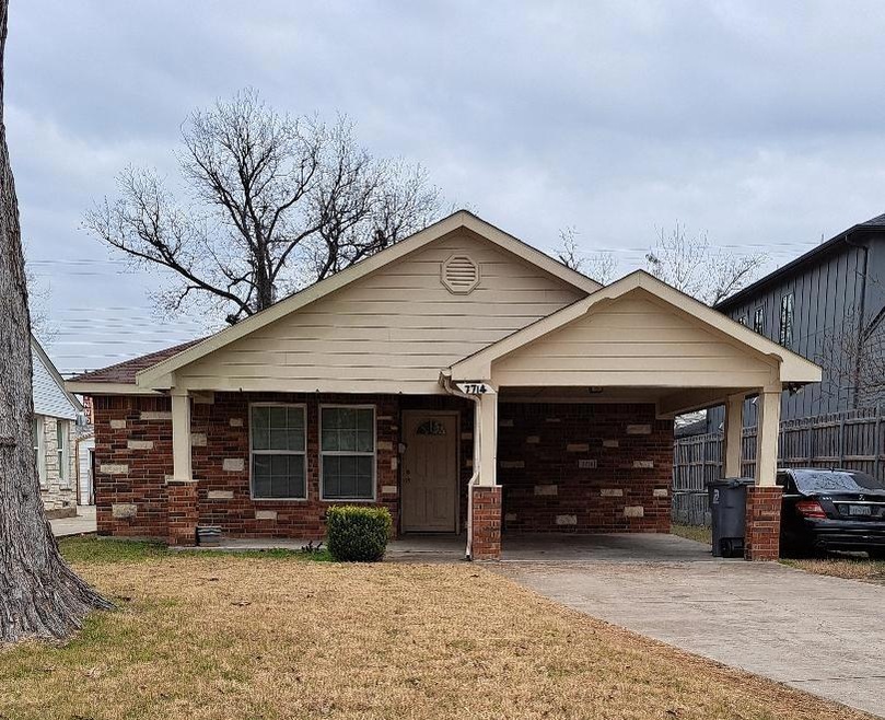 View of front of property with a carport and a fro