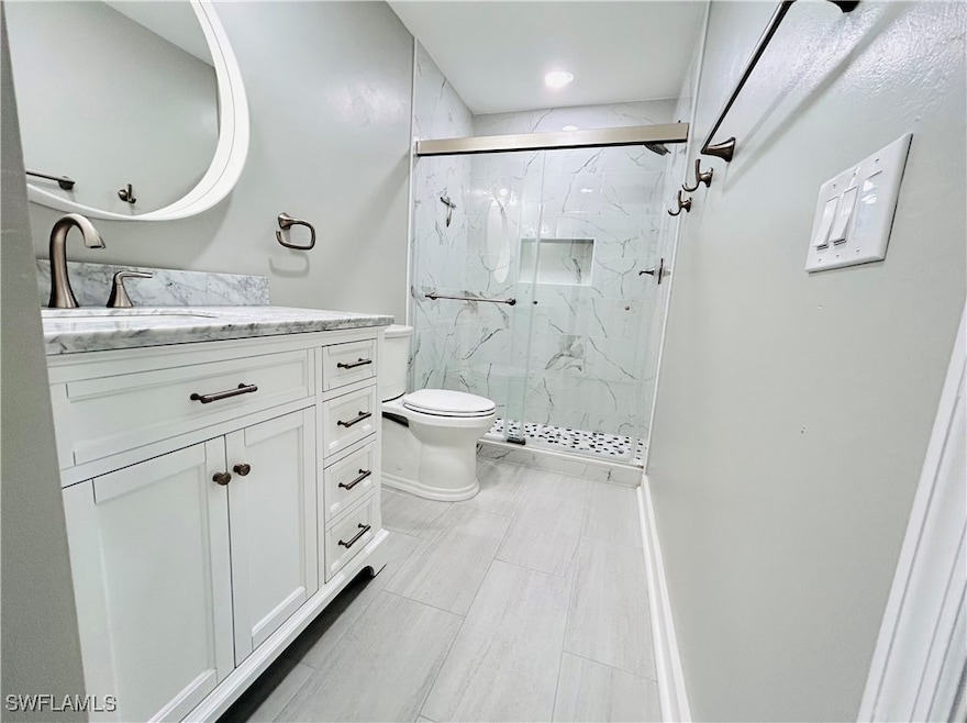 Master Full bathroom with toilet, vanity, and a ma