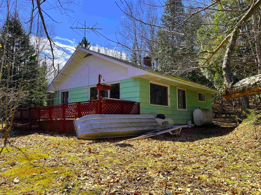 Back of property with a wooden deck