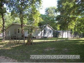 SIDEVIEW OF HOME AND CARPORT