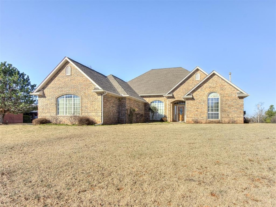 View of front of property with brick siding, a fro