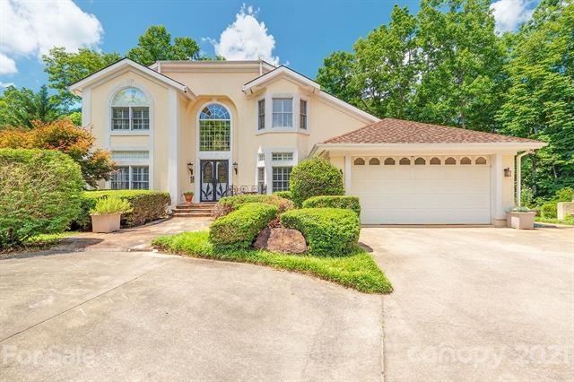 Beautiful stucco home with windows galore.