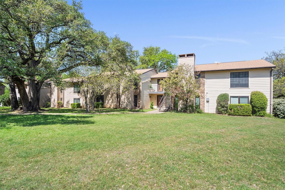 View of front of house with a chimney, a front la