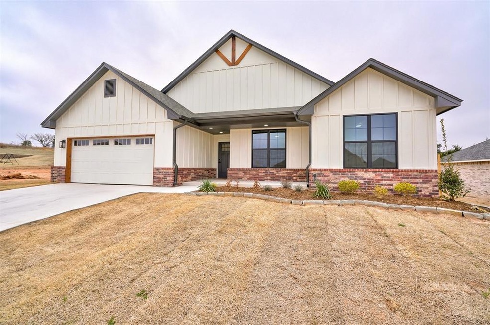 Modified Craftsman Style home with professional landscaping, popular black windows and cedar accents.