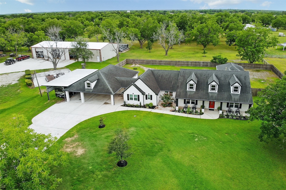 It isn't often that a property comes on the market that checks off all of the boxes.  This bird's-eye view of the expansive, lush grounds of 18042 County Road 127 exhibits the multiple amenities this estate possesses which include a single-story, three bedroom home, a pool with an adjacent cabana house that can act as a game room or another guest suite and the 5,000 square foot 'barndominium' with its very own guest quarters.