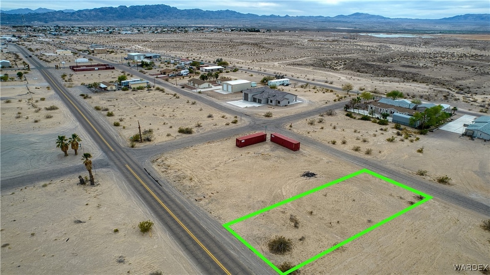Birds eye view of property featuring view of desert, a rural view, and a mountain view