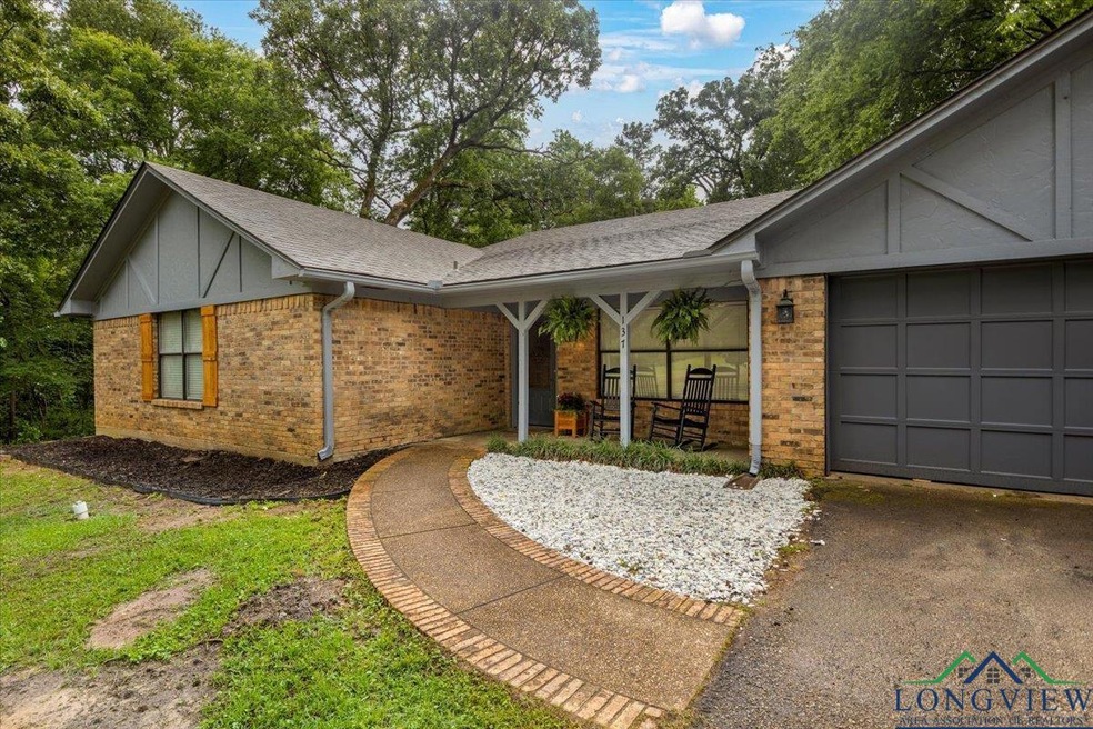 Ranch-style home featuring an attached garage, a s