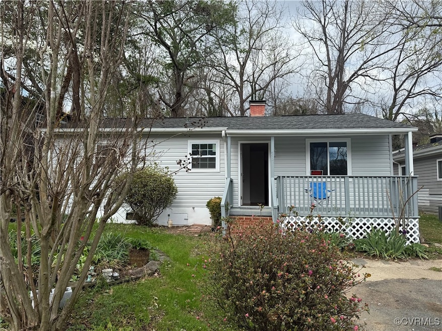 View of front of home with roof with shingles, a c