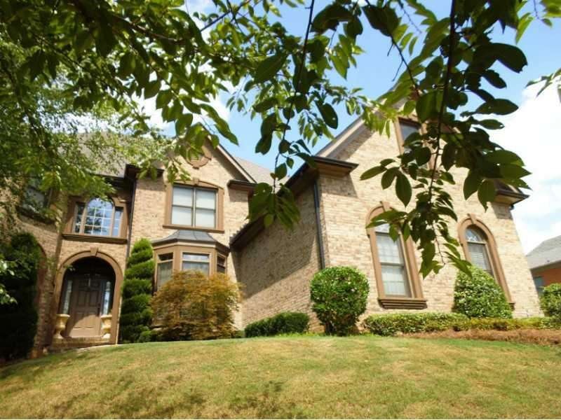 Exterior Front. 3 sided brick, rear with hard coat