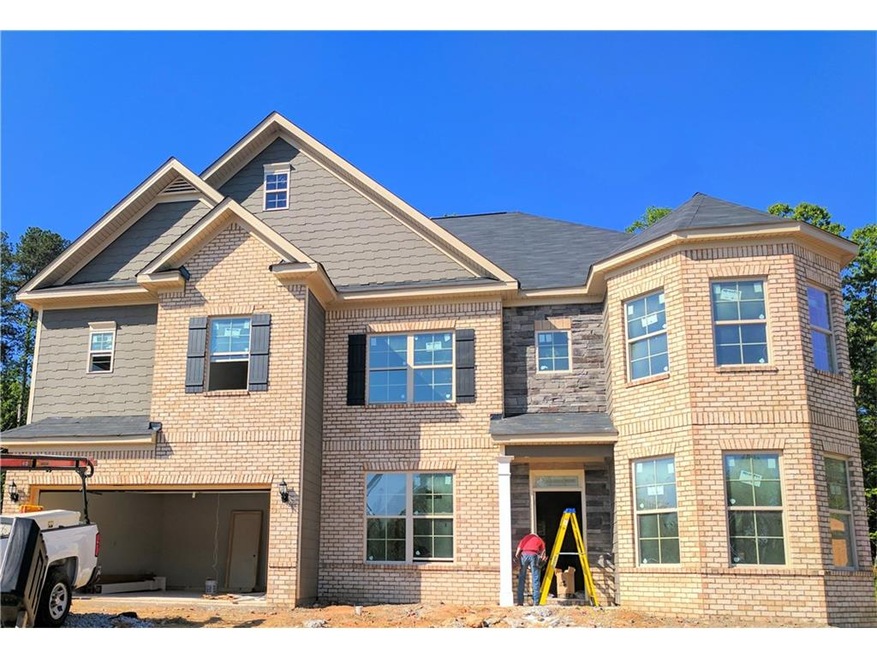 Beautiful elevation featuring a turret that gives 