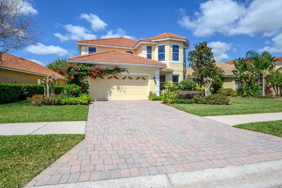 Front view of the house: Paved driveway, professio