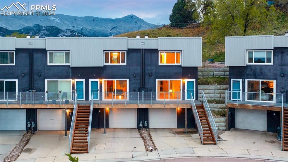 View of property featuring a mountain view and a g
