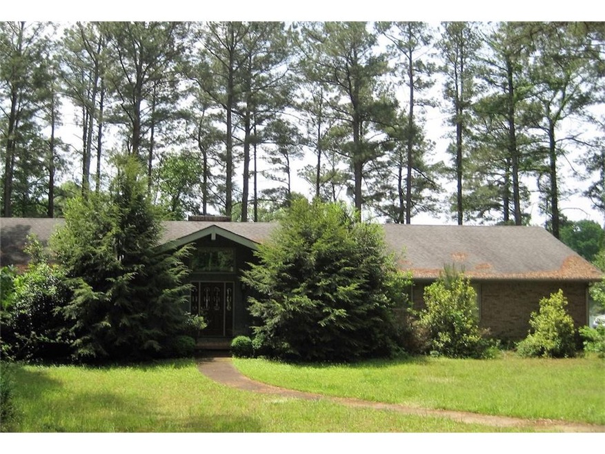 Potential fixer upper located on a lake lot