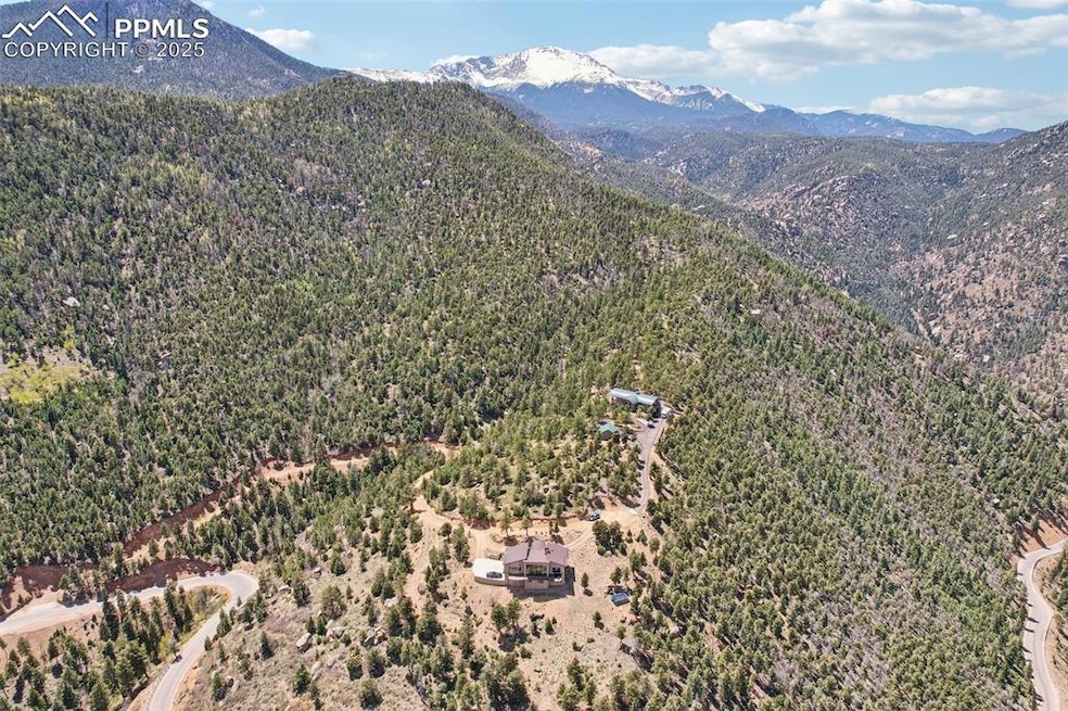 Ariel view of this custom mountain home with pikes peak in the background!