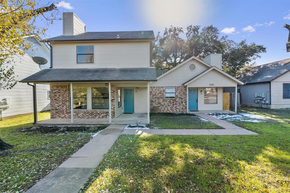 View of front of property featuring a chimney, br