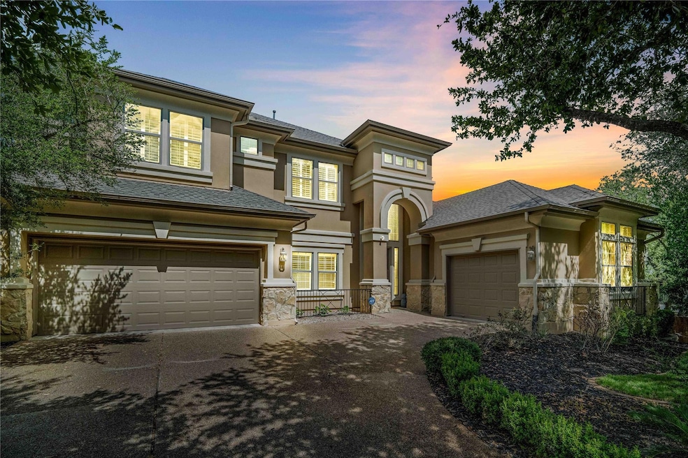 Prairie-style house with driveway, stucco siding,