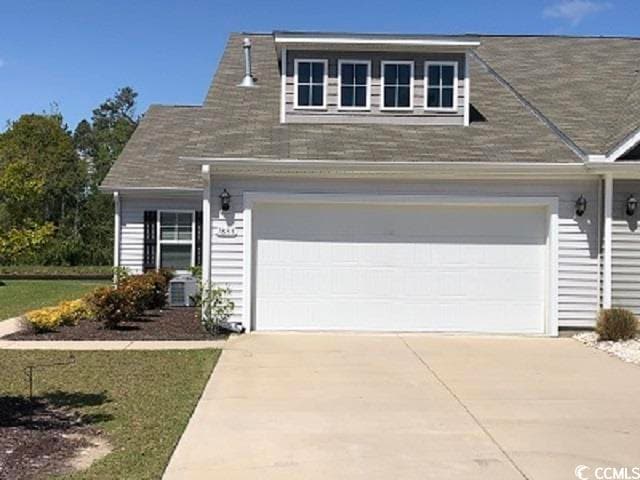 View of front facade with concrete driveway
