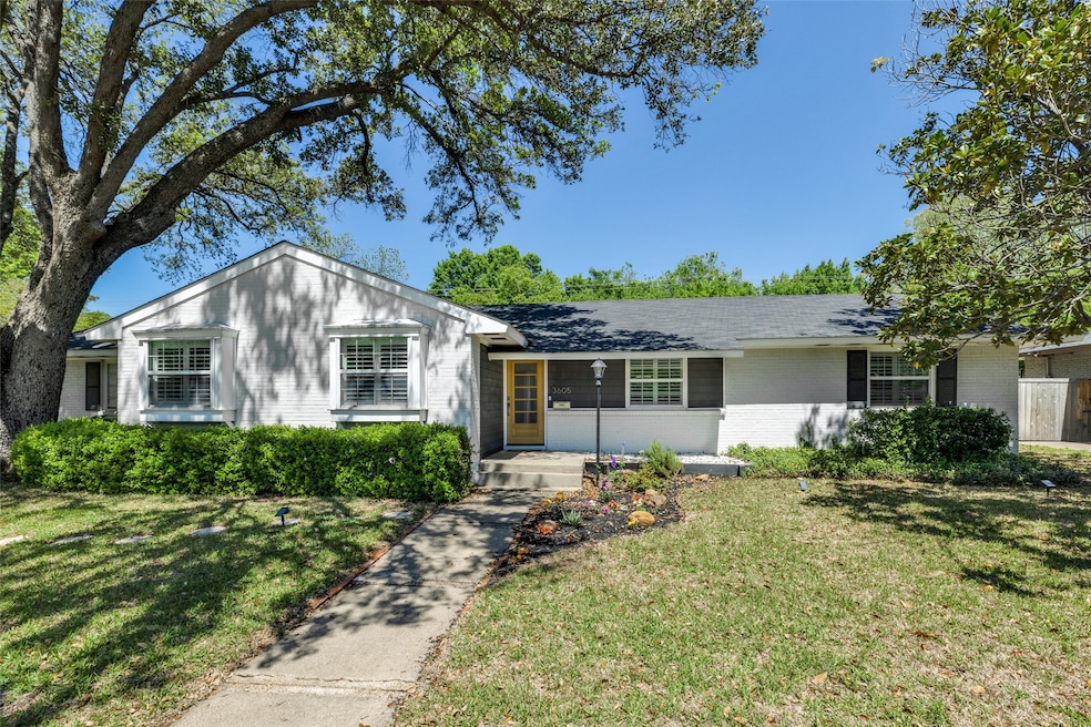 Single story home with brick siding and a front yard
