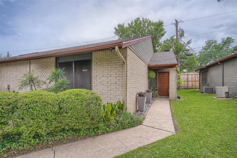 View of side of home with a central air condition