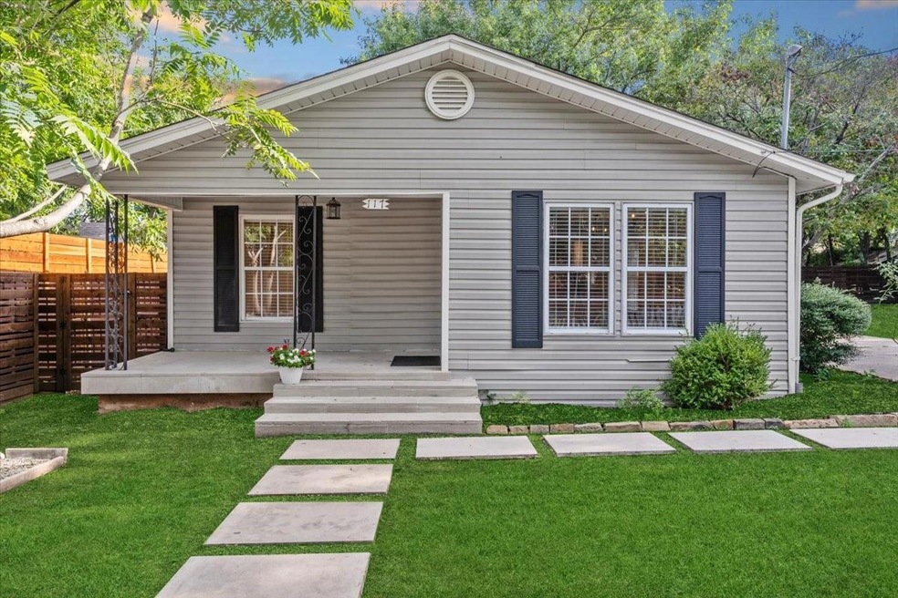 View of front of home with covered porch and a fro