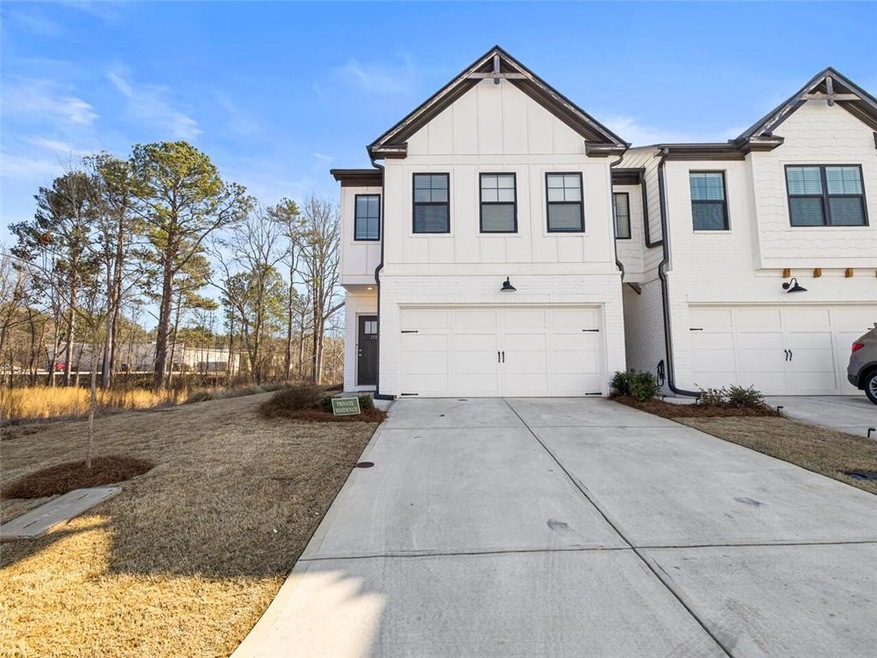 View of front of property featuring a garage